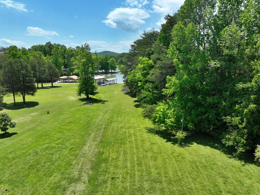 Unlock the potential of this charming lakefront fixer-upper on - photo 4