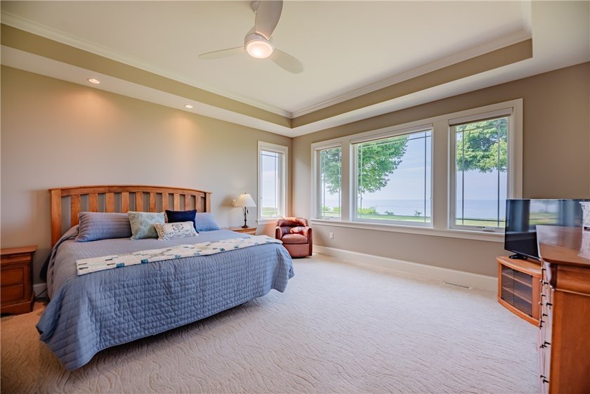 Welcome to waterfront living at its finest. Perched above the - photo 28