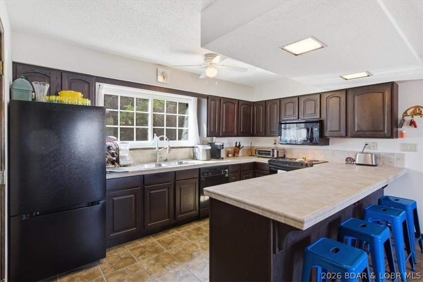 Looking for the perfect lake retreat? This Osage Heritage condo - photo 11