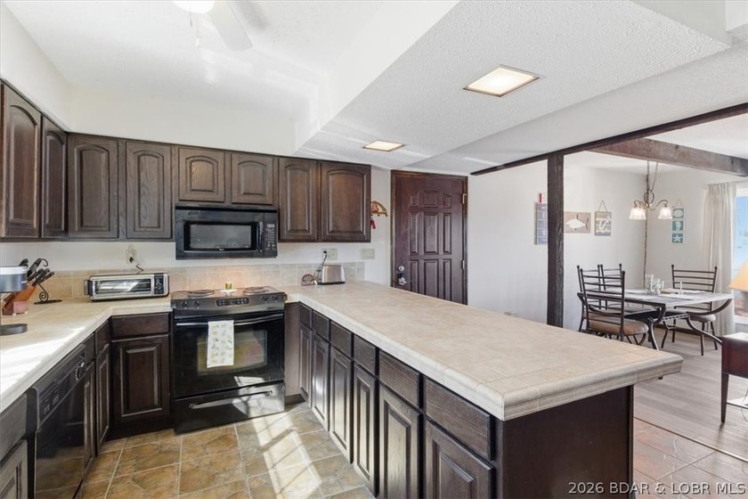 Looking for the perfect lake retreat? This Osage Heritage condo - photo 12