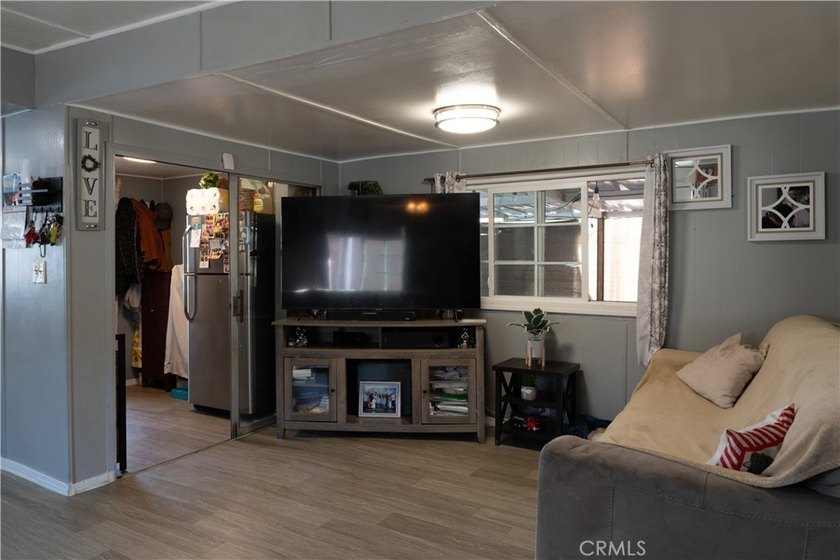 Ready to move in! This affordable, low land lease mobile home in - photo 3
