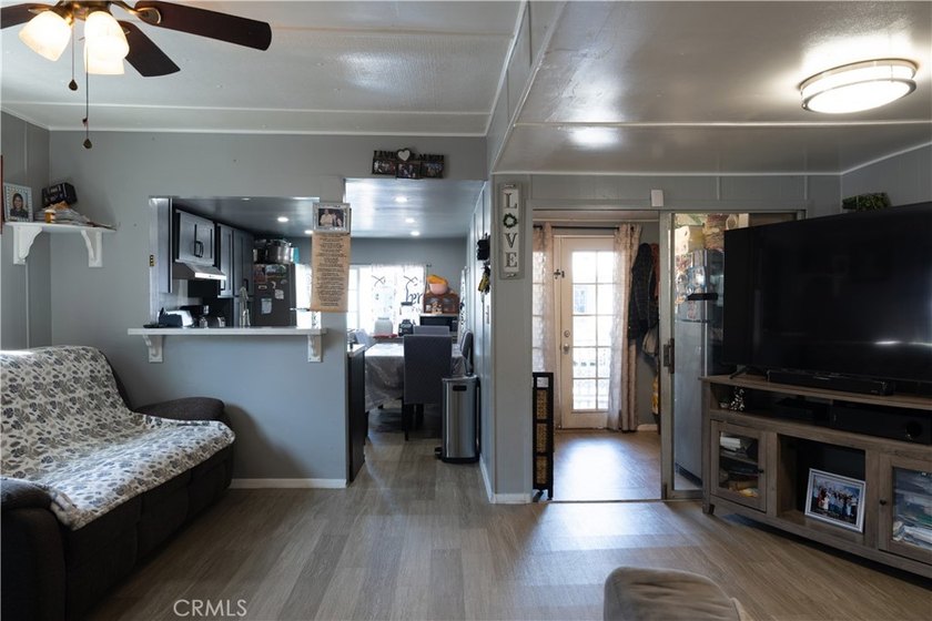 Ready to move in! This affordable, low land lease mobile home in - photo 5