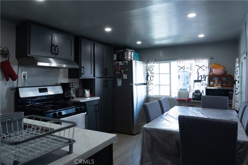 Ready to move in! This affordable, low land lease mobile home in - photo 8