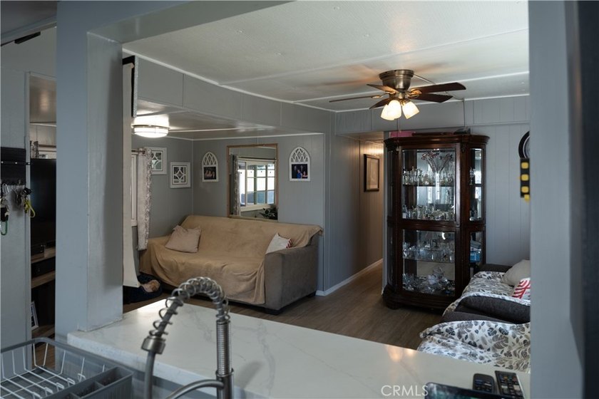 Ready to move in! This affordable, low land lease mobile home in - photo 10