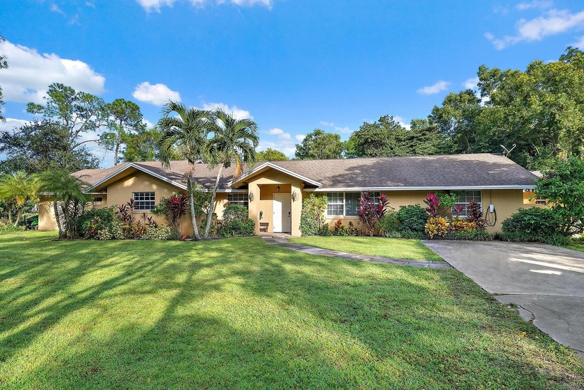 Back on the Market! NEW ROOF!Jupiter Farms Acre+ Retreat with - photo 25