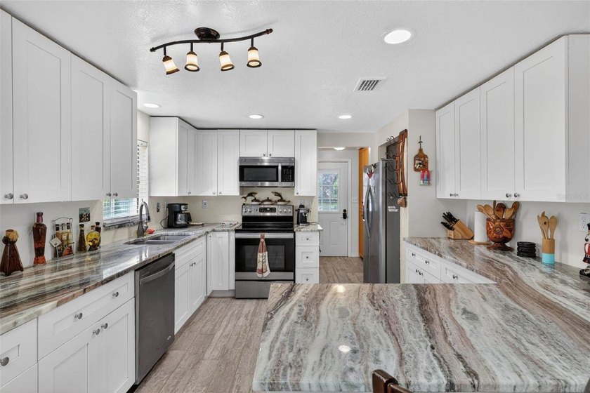 Investor's dream! Situated on 1 acre in a prime location, this - photo 21