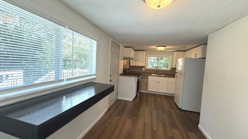 Enjoy the perfect blend of privacy and lake-area living in this - photo 13