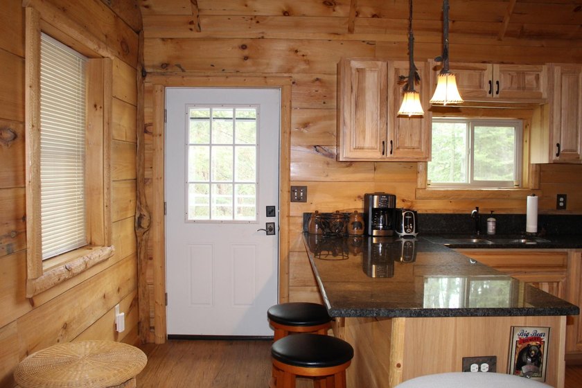 Located in the heart of the Northwoods on Moen Lake, this - photo 12