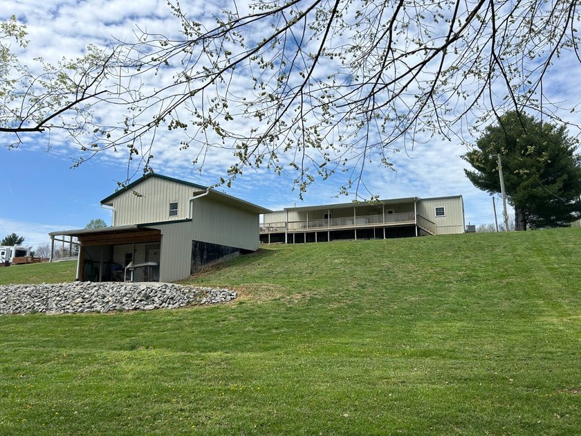 MOBILE HOME W/ ADDITION-STORAGE BLDGS. - NEAR HOLMES BEND MARINA - photo 49