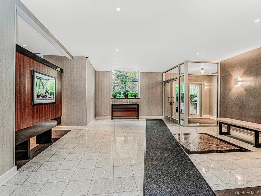Welcome home to this bright and inviting top-floor one-bedroom - photo 11