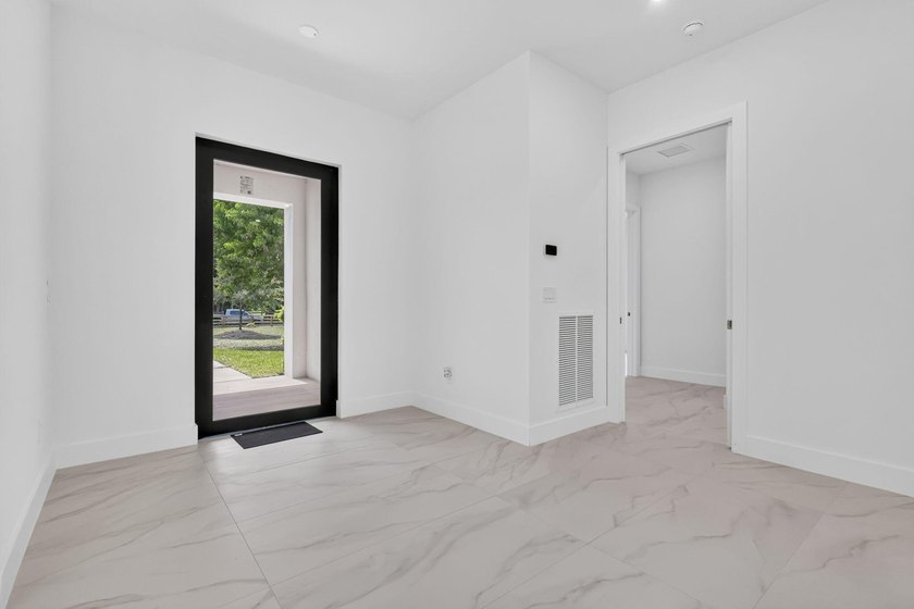 Welcome to this 2026 modern residence, nestled on a private - photo 13