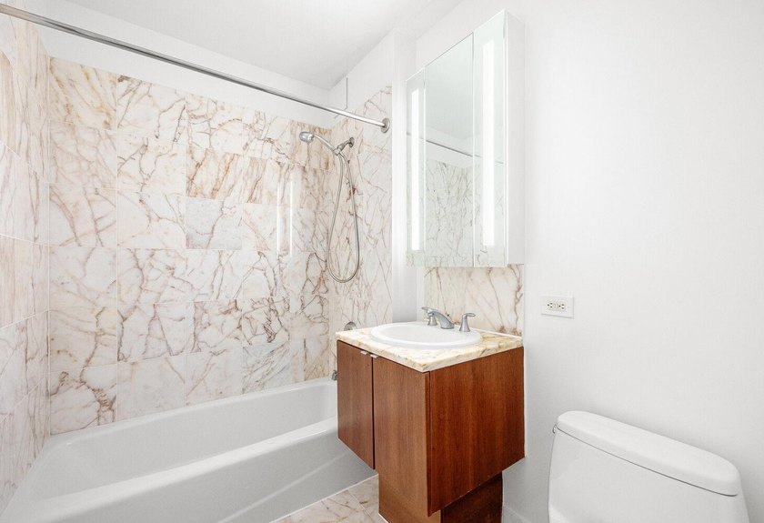 This bright and spacious 2-bedroom, 2-bathroom residence in the - photo 13