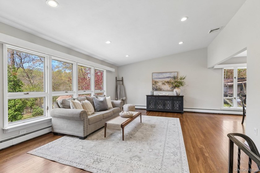 Set on a full acre and surrounded by mature trees and lush - photo 8