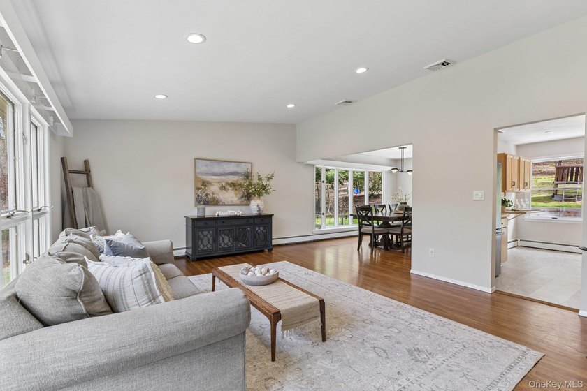 Set on a full acre and surrounded by mature trees and lush - photo 9