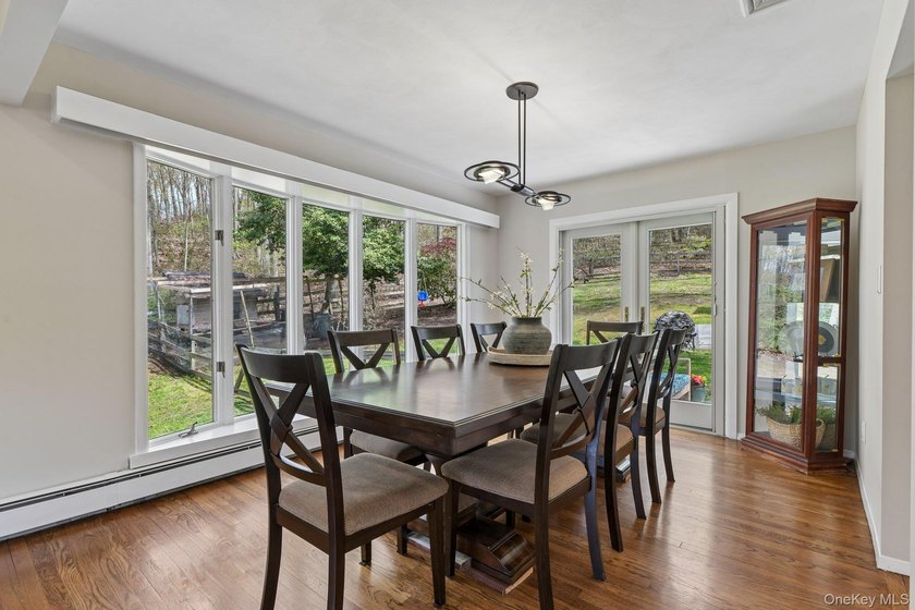 Set on a full acre and surrounded by mature trees and lush - photo 10