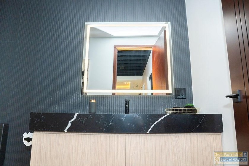 Come view this exquisite channel-front coastal home. With its - photo 13