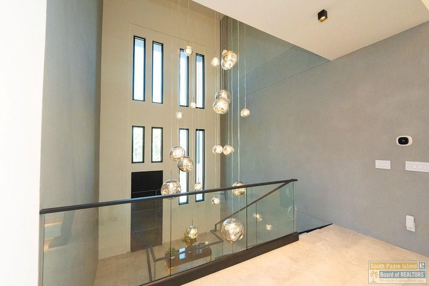 Come view this exquisite channel-front coastal home. With its - photo 23