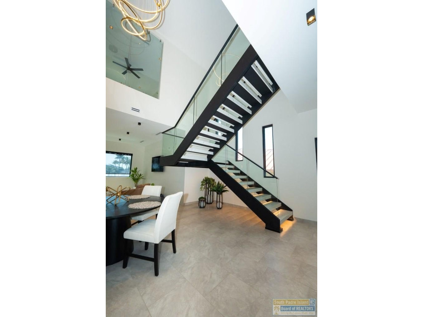Come view this exquisite channel-front coastal home. With its - photo 38