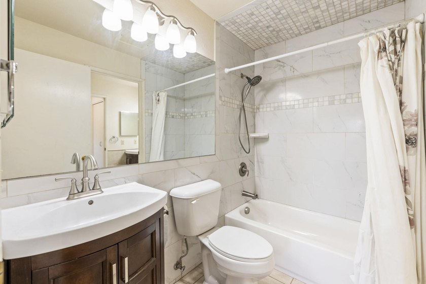 Two bedroom 1.5 bath second floor condo priced to sell in very - photo 12