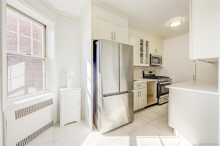 Welcome to this stunning Top-Floor 2-Bedroom, 2-Bath in an - photo 14