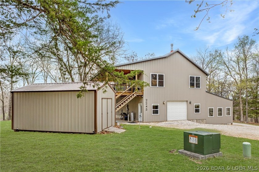 Situated on 4.43 acres just minutes from Camdenton, this - photo 34
