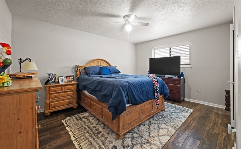 This 3-bed, 2-bath brick home sits on a large corner lot in an - photo 15