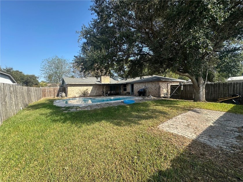 This 3-bed, 2-bath brick home sits on a large corner lot in an - photo 19