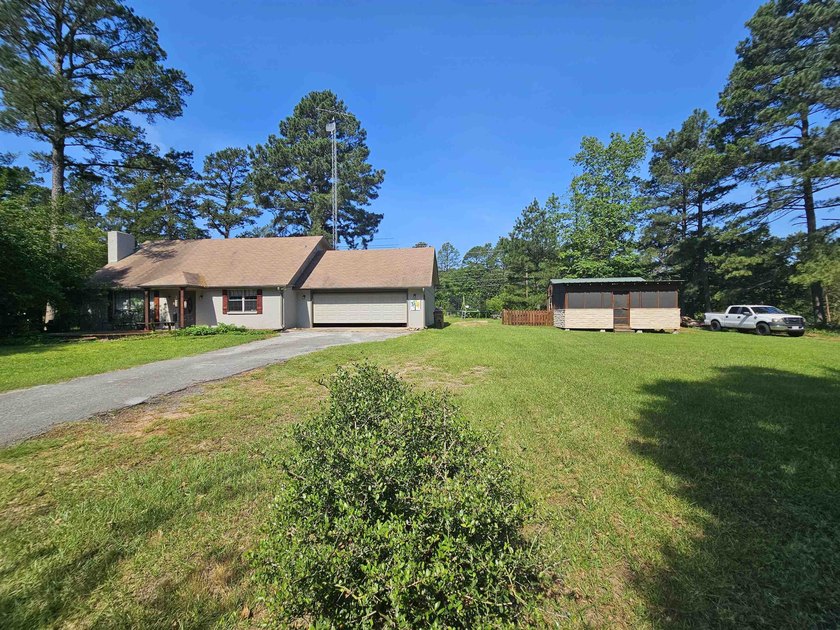 Tucked away in the gated community of Holly Lake Ranch, this - photo 2