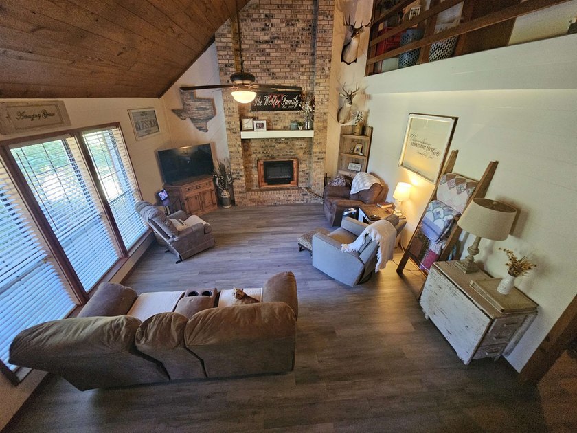 Tucked away in the gated community of Holly Lake Ranch, this - photo 6