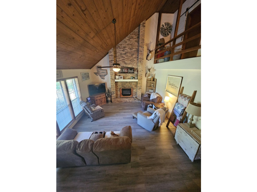 Tucked away in the gated community of Holly Lake Ranch, this - photo 7