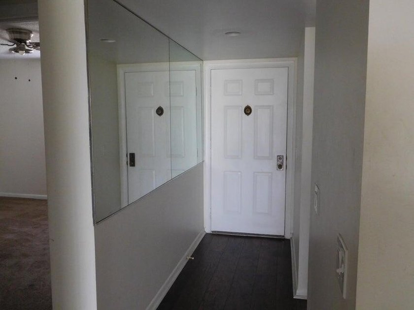 UPDATED 3RDFLOOR END UNIT WITH COURTYARD AND PARTIAL GOLF VIEWS - photo 2