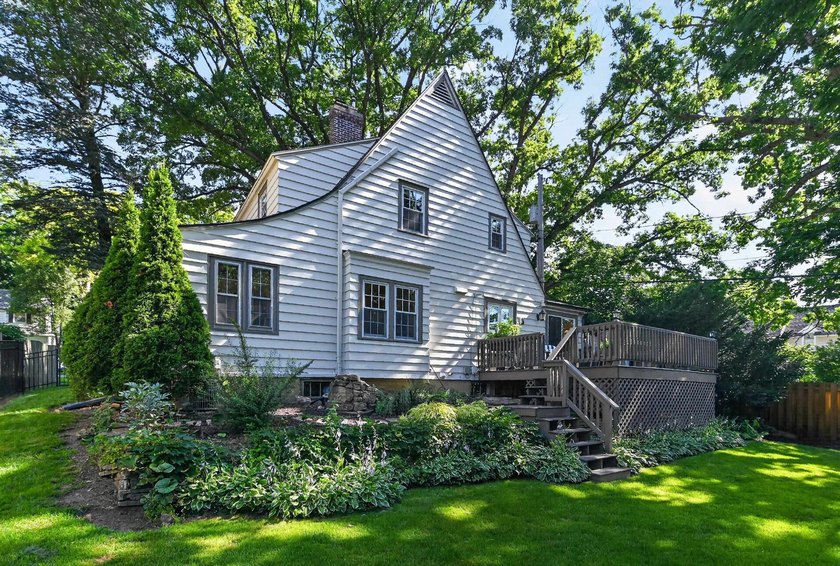 Nestled on a quiet, tree-lined street beneath a canopy of mature - photo 40