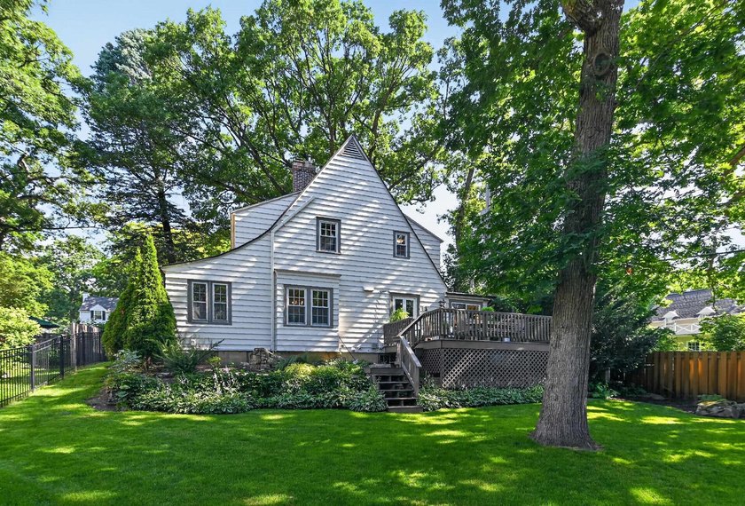 Nestled on a quiet, tree-lined street beneath a canopy of mature - photo 41