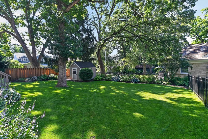 Nestled on a quiet, tree-lined street beneath a canopy of mature - photo 43