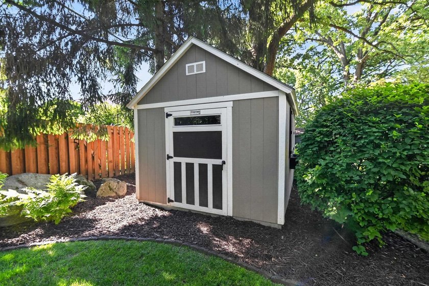Nestled on a quiet, tree-lined street beneath a canopy of mature - photo 44