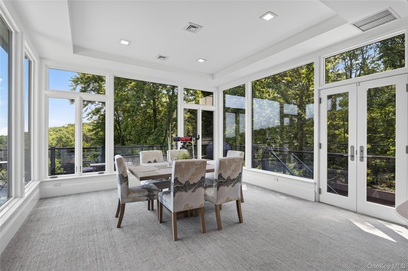 Perched above Oyster Bay Harbor on 4.04 private acres in the - photo 25