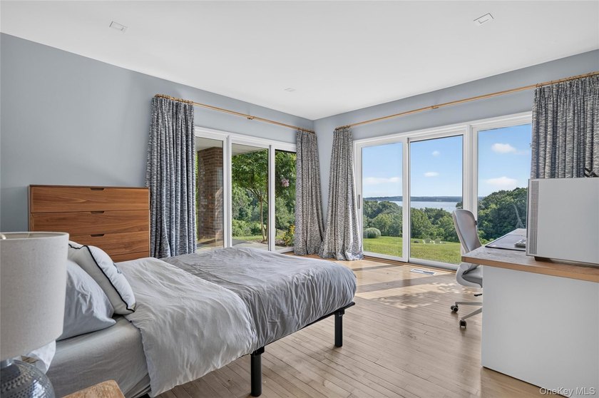 Perched above Oyster Bay Harbor on 4.04 private acres in the - photo 35