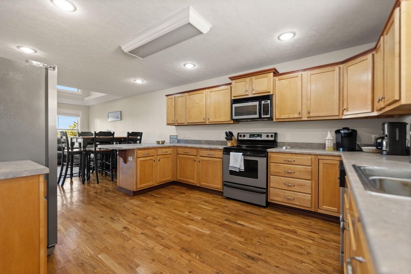Sunset views and three levels of lake living await in this - photo 11