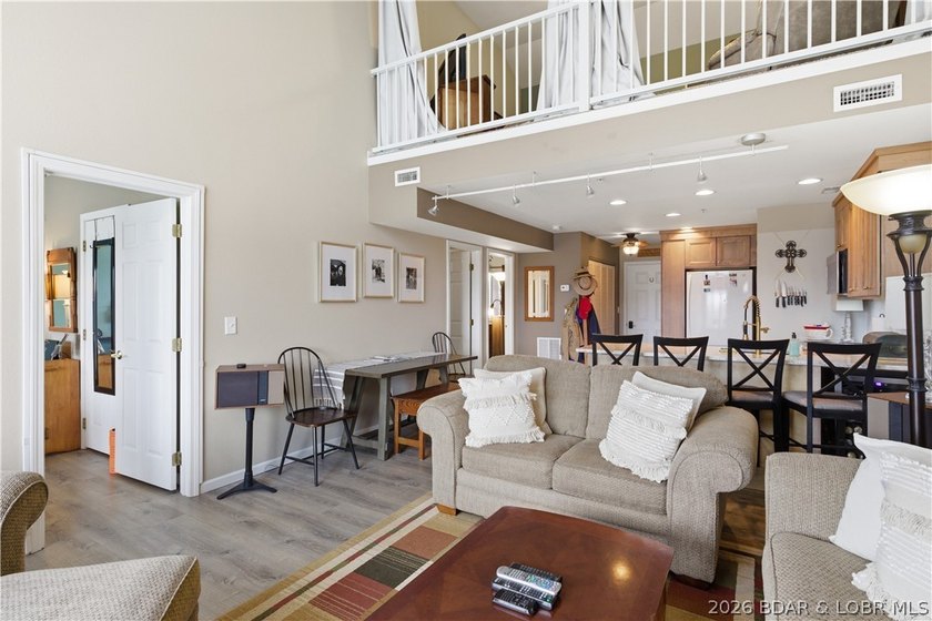 Top-floor condo with soaring vaulted ceilings and dramatic - photo 12