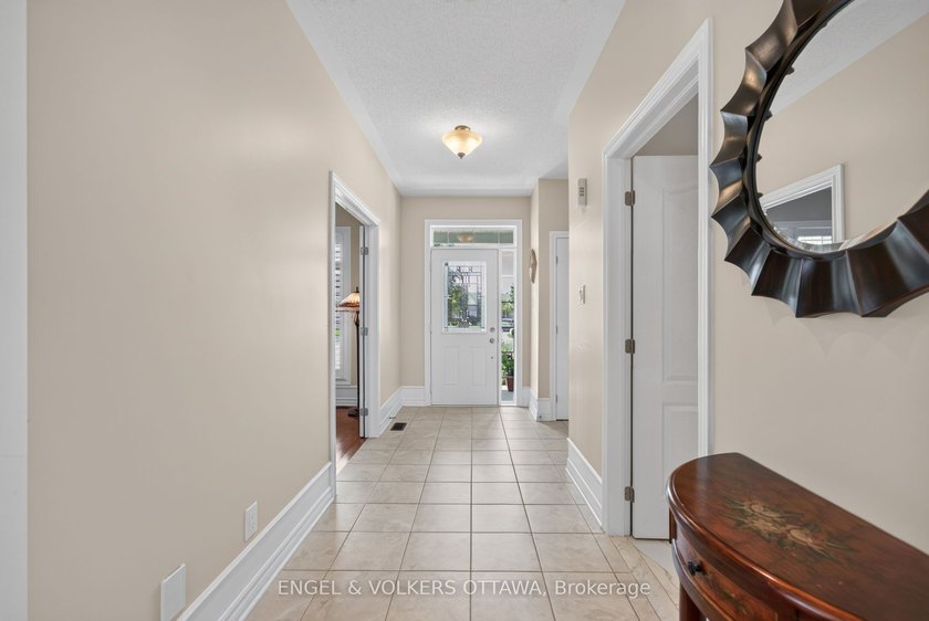 This exceptional bungalow backs directly onto the renowned - photo 3