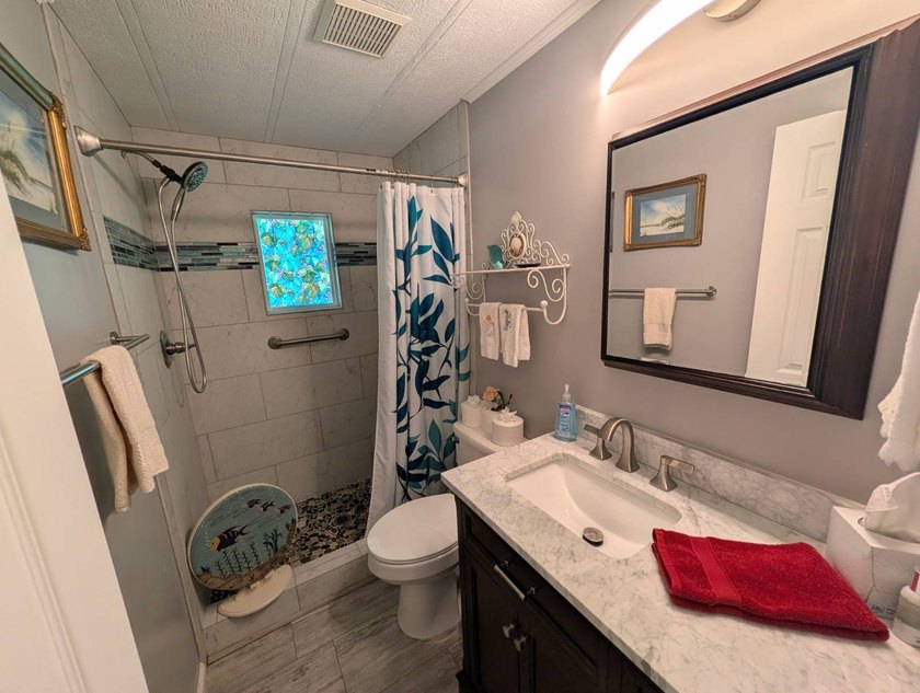 This stunning fully furnished lakefront home in the 55+ - photo 26