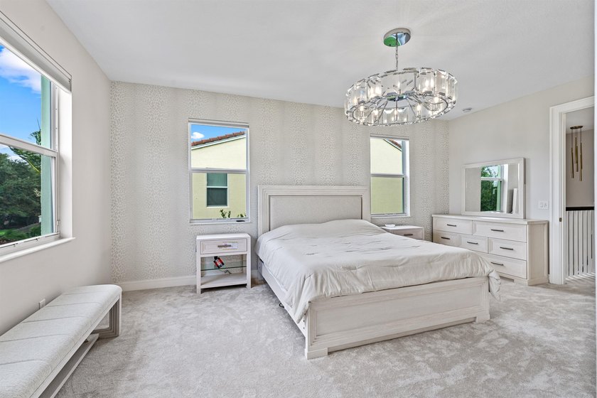 Set on a beautifully landscaped parcel, the covered loggia opens - photo 18