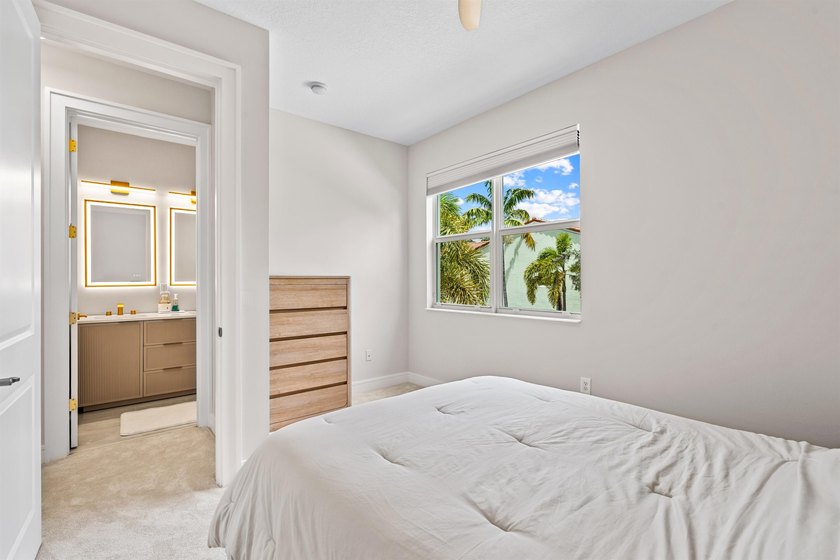 Set on a beautifully landscaped parcel, the covered loggia opens - photo 23