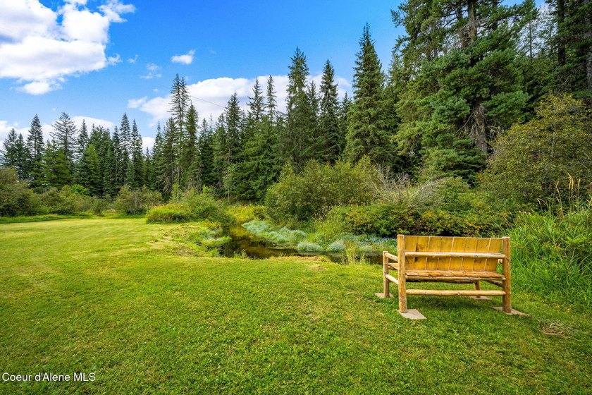 This serene 1.25 acre property on Lamb Creek offers 200 ft. of - photo 3