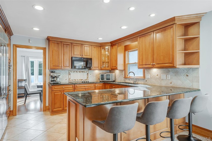 Set within the serene landscape of Rolling Woods in Riverhead - photo 22