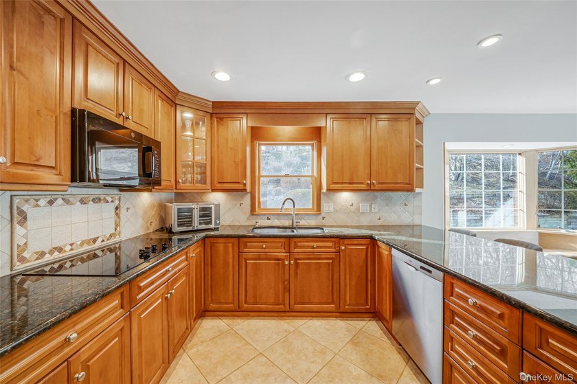 Set within the serene landscape of Rolling Woods in Riverhead - photo 24