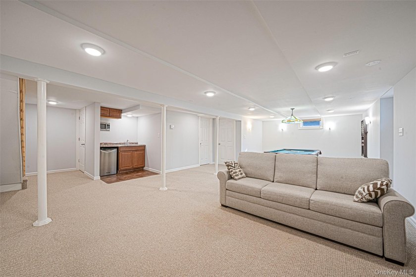 Set within the serene landscape of Rolling Woods in Riverhead - photo 45