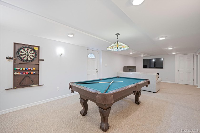 Set within the serene landscape of Rolling Woods in Riverhead - photo 46