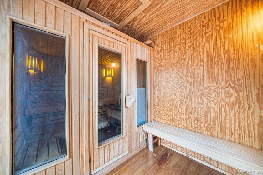 Set within the serene landscape of Rolling Woods in Riverhead - photo 49