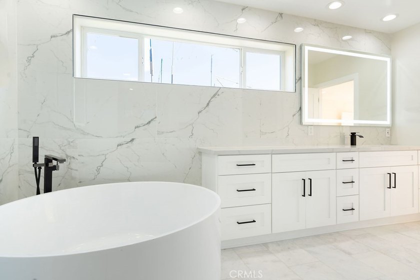This newly renovated home with breathtaking 180-degree ocean - photo 47